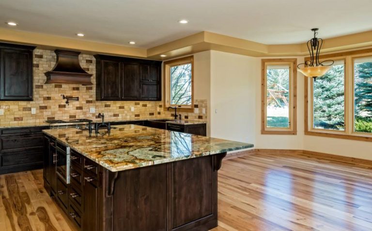 remodeled kitchen with wooden floor and countertop