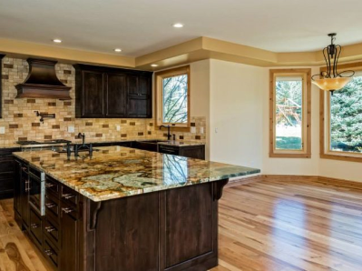 remodeled kitchen with wooden floor and countertop