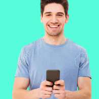 person smiling while holding a cellphone