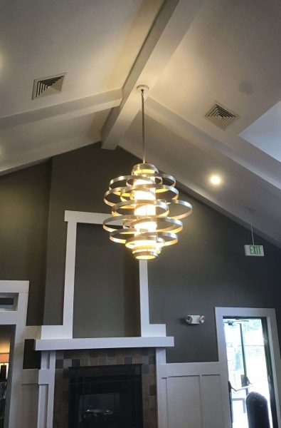 spiral chandelier installed on a ceiling of a room